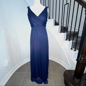 Navy blue ruched v-neck sleeveless, fully lined empire waist gown. Size 6
